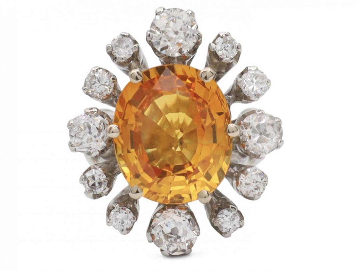 Modern 6.52ct fancy yellowish orange sapphire and old cut diamond cluster ring