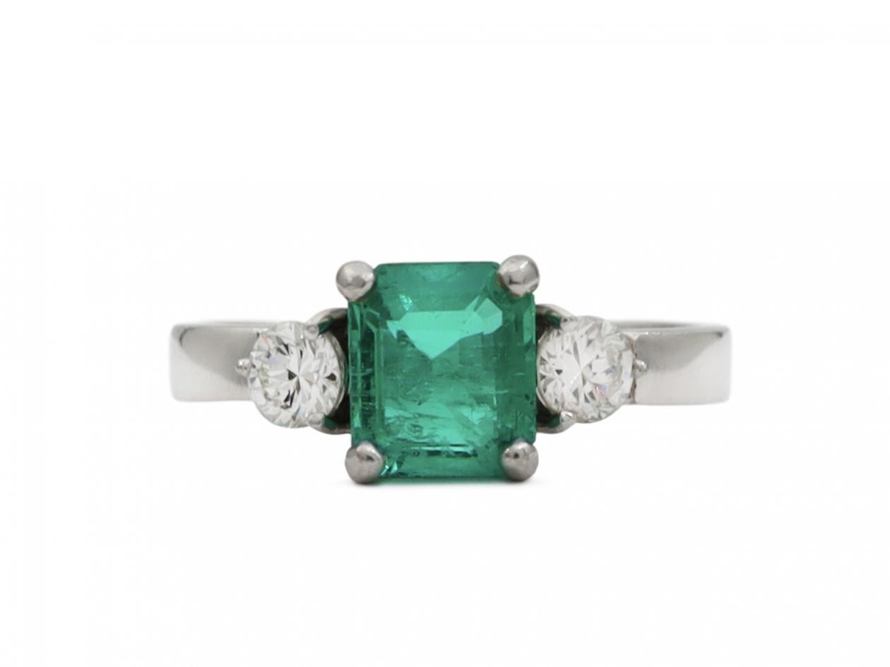 Modern square emerald and diamond three stone ring
