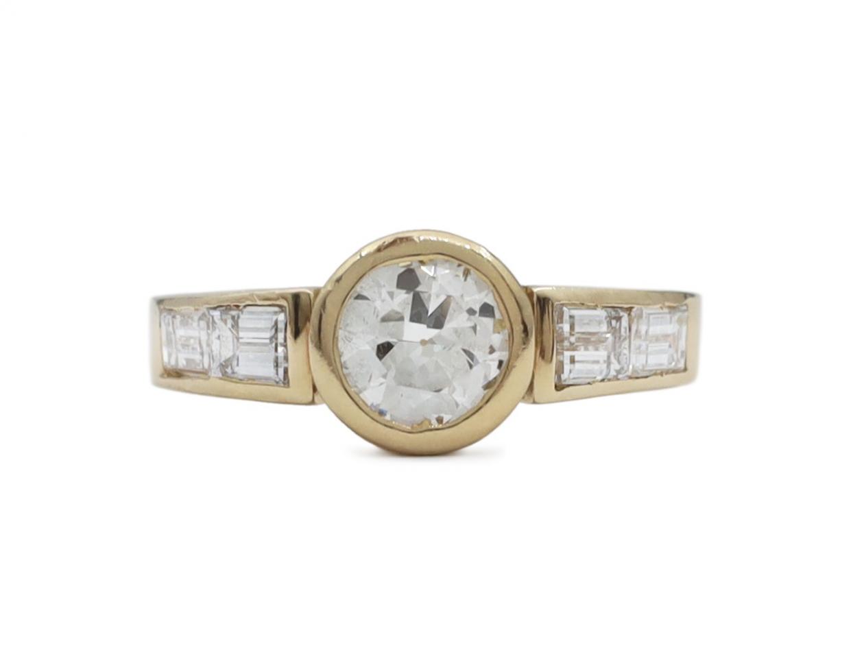 Vintage bezel set solitaire diamond engagement ring in gold