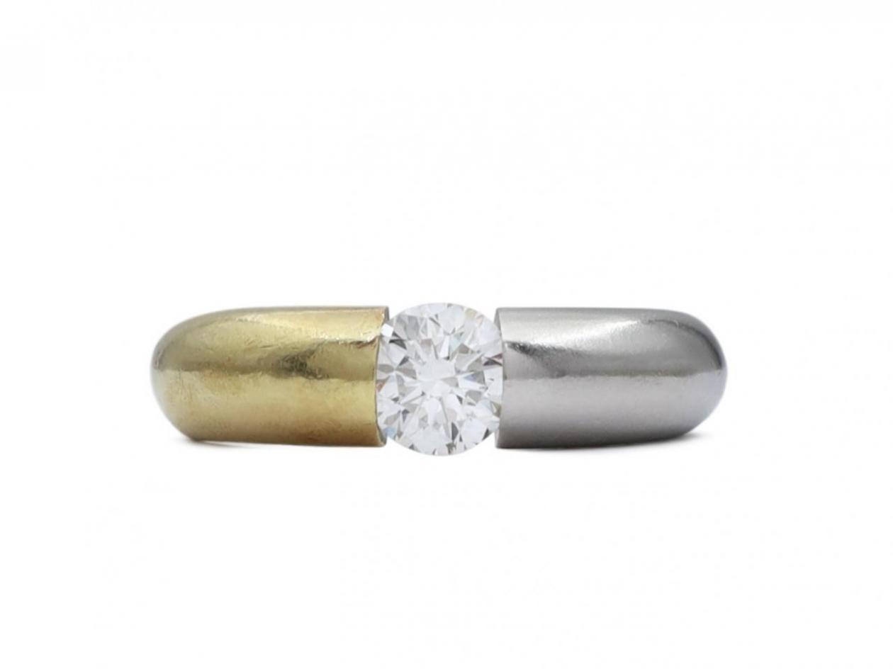 Contemporary 18kt yellow gold and platinum diamond solitaire ring