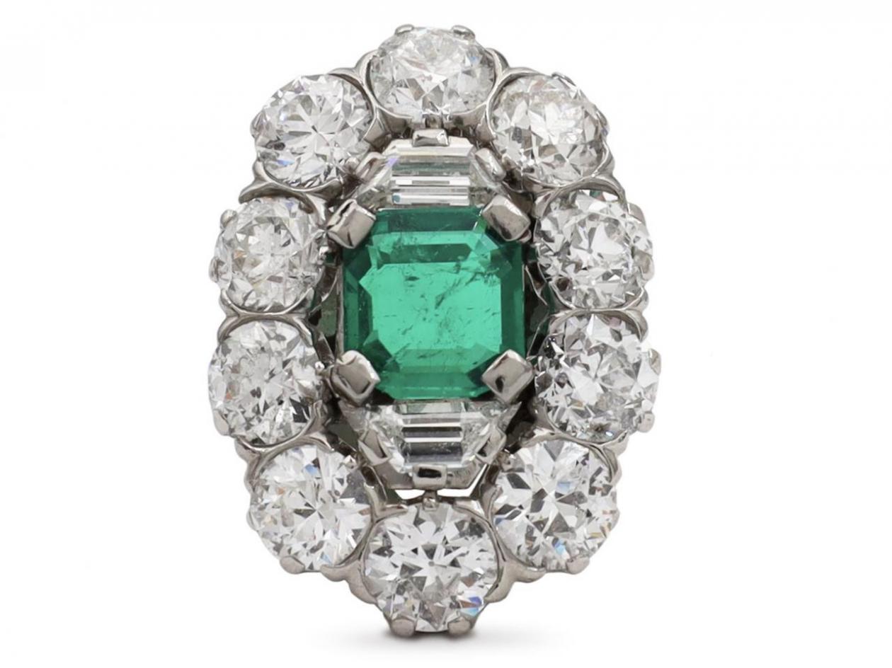 Impressive retro emerald and diamond cluster ring in platinum