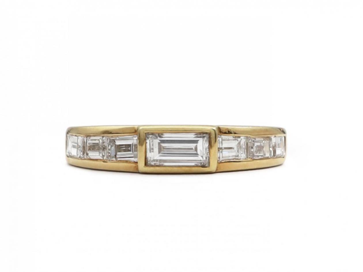 Vintage channel set East to West baguette cut diamond ring in gold
