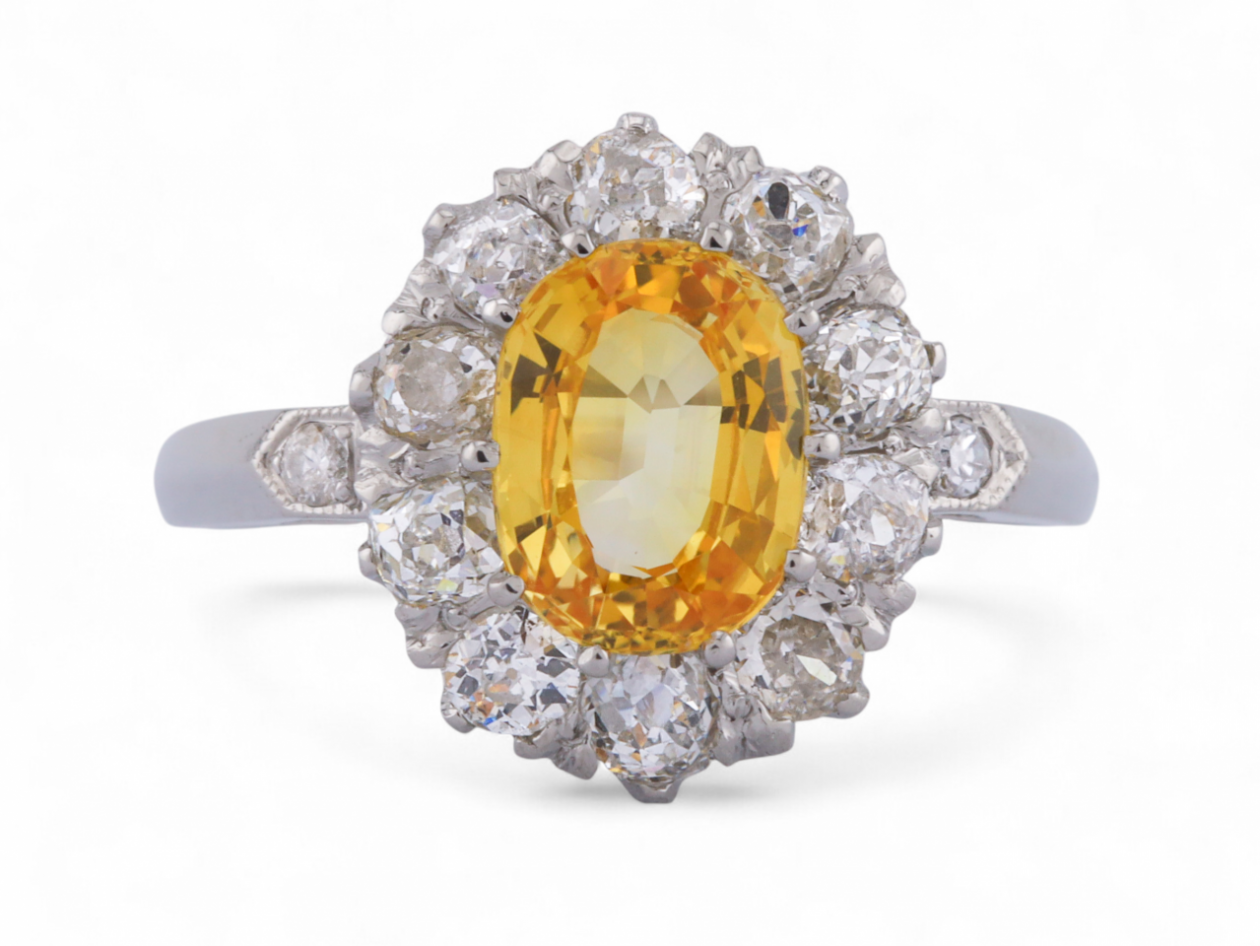 Vintage fancy yellow sapphire and old mine cut diamond oval cluster ring in platinum – Matthew Weldon