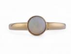Contemporary bezel set opal solitaire ring in 18kt yellow gold – Matthew Weldon