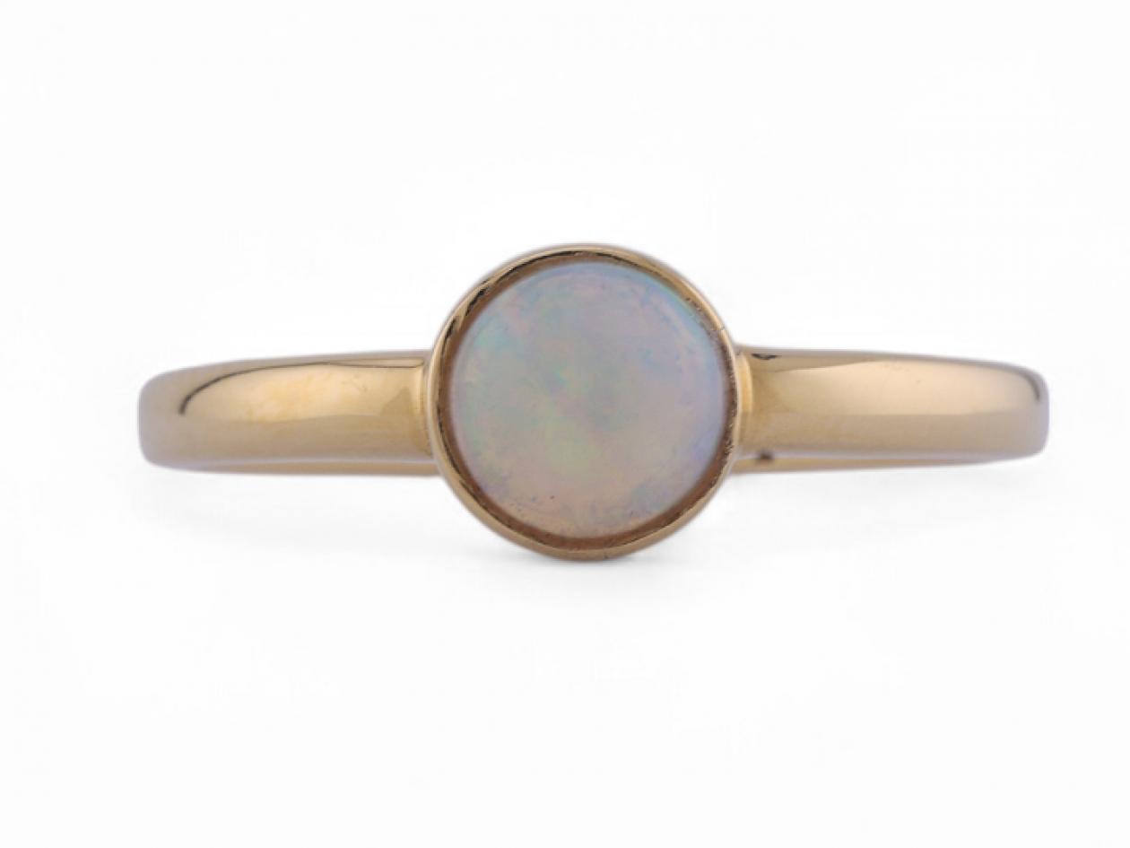 Contemporary bezel set opal solitaire ring in 18kt yellow gold – Matthew Weldon