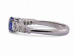 Modern Italian 18kt white gold ring with 0.90ct oval sapphire and 0.64ct diamond shoulders