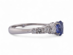 Modern Italian 18kt white gold ring with 0.90ct oval sapphire and 0.64ct diamond shoulders