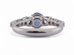 Modern Italian 18kt white gold ring with 0.90ct oval sapphire and 0.64ct diamond shoulders