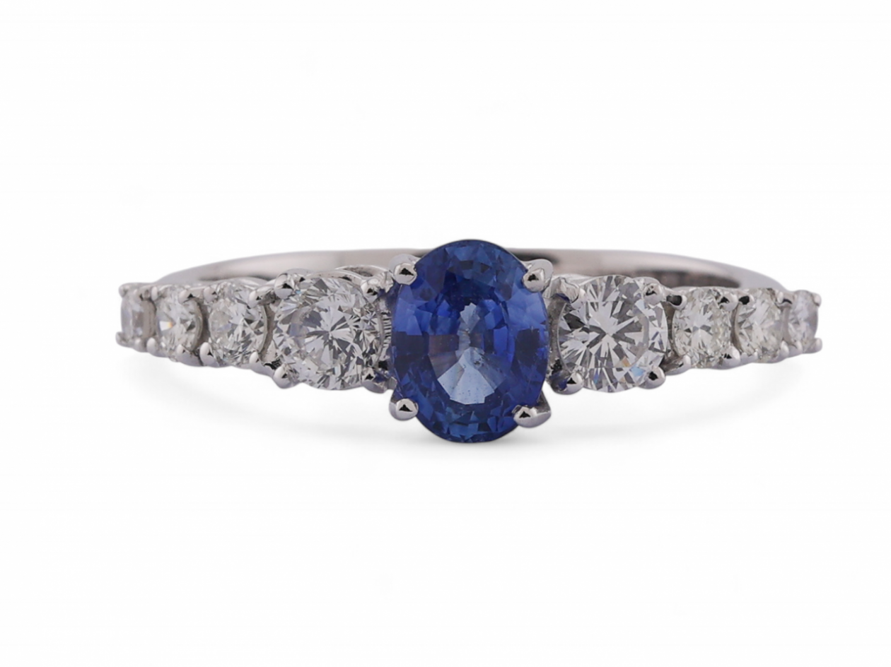 Modern Italian 18kt white gold ring with 0.90ct oval sapphire and 0.64ct diamond shoulders
