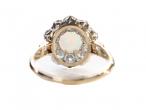 A Victorian cluster ring featuring a cabochon opalA Victorian cluster ring featuring a cabochon opalA Victorian cluster ring featuring a cabochon opal