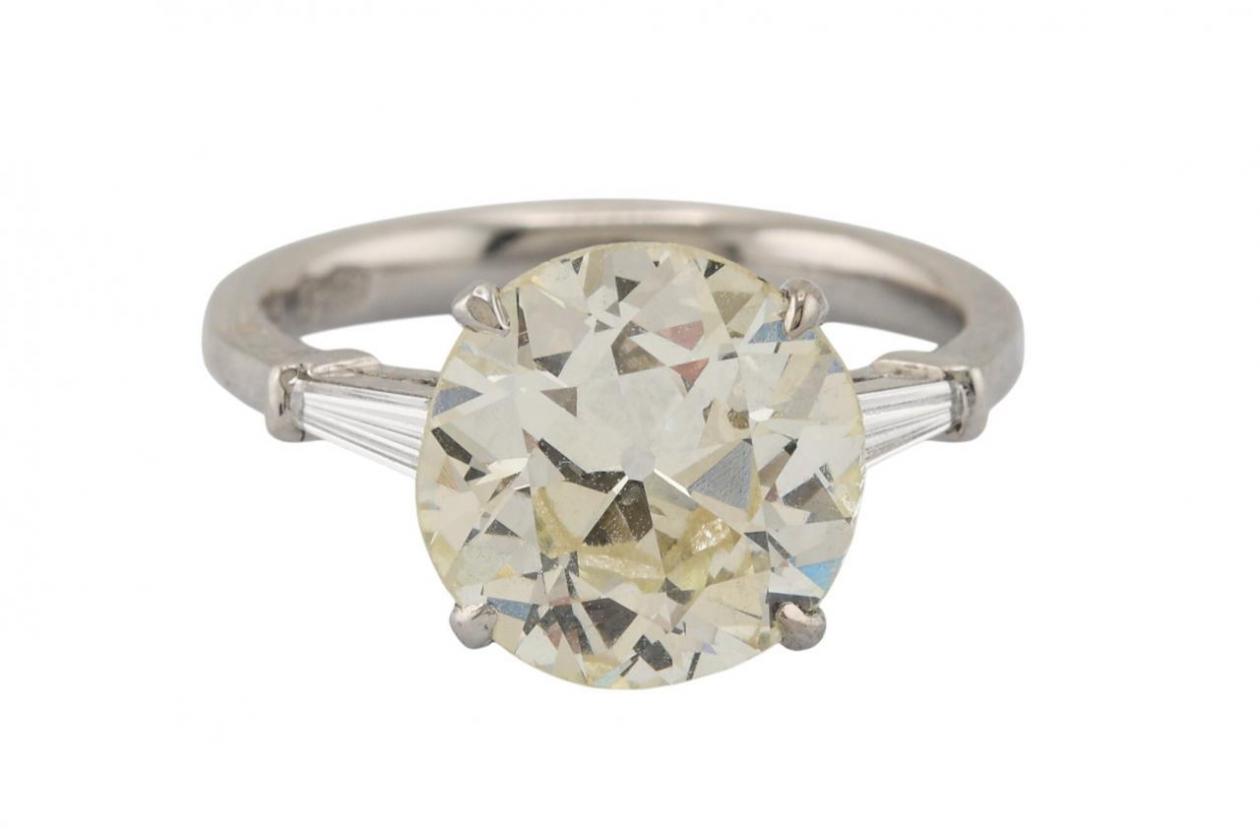 A platinum solitaire ring set with an old European cut