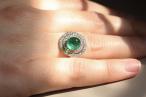Edwardian Cabochon Emerald ring with tiered double diamond millgrain border