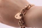 Vintage curb link rose gold bracelet with heart shape locket