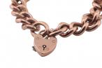 Vintage curb link rose gold bracelet with heart shape locket