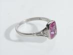 Pink sapphire solitaire ring with diamond set shoulders