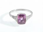 Pink sapphire solitaire ring with diamond set shoulders