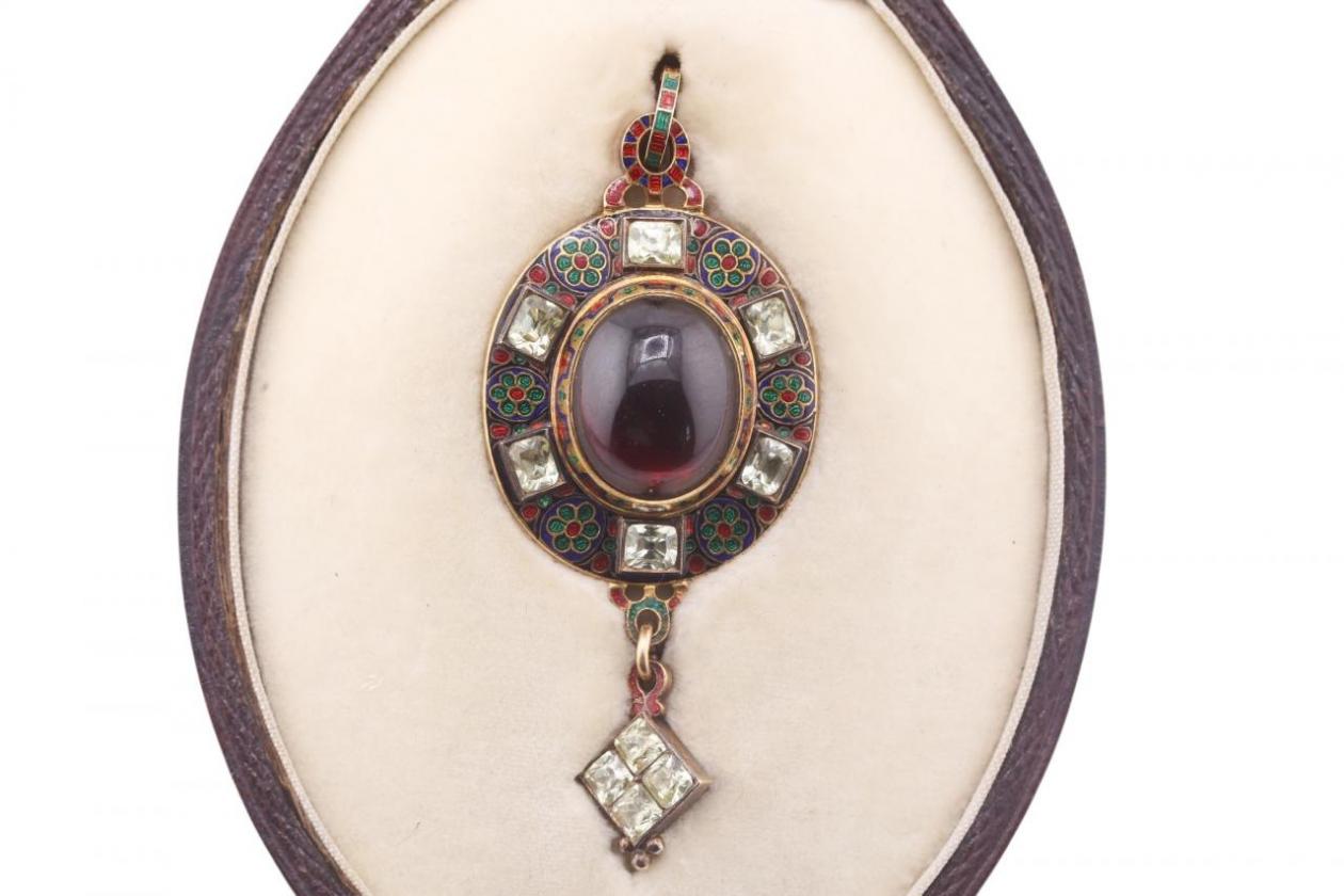 RENAISSANCE REVIVAL GARNET, CHRYSOBERYL AND ENAMEL HOLBEINESQUE PENDANT, CIRCA 1870.