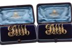 LATE VICTORIAN GOLD AND SEED-PEARL MONOGRAM BROOCHES, CIRCA 1890