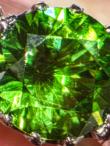 DEMANTOID GARNET AND DIAMOND THREE STONE RING, CIRCA 1960