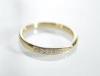 18kt yellow gold diamond set band with a pinched centre