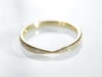 18kt yellow gold diamond set band with a pinched centre