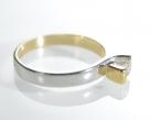 Contemporary two tone 18kt gold diamond solitaire twist ring