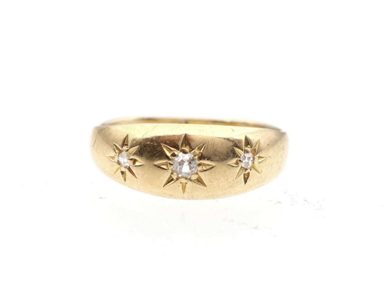 Antique three stone diamond gypsy ring in yellow gold