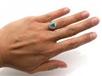 Vintage emerald and diamond oval cluster ring in platinum