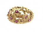 Contemporary modernist openwork dress ring in 9kt gold set with pink paste