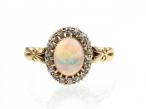 Antique oval opal and diamond cluster ring in 18kt yellow gold