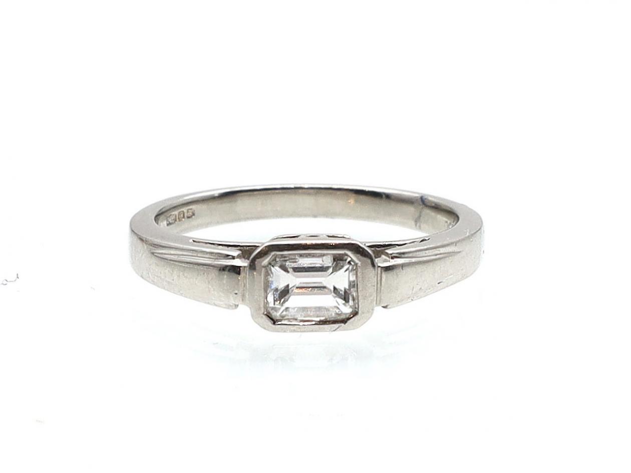 Art Deco emerald cut east to west diamond solitaire