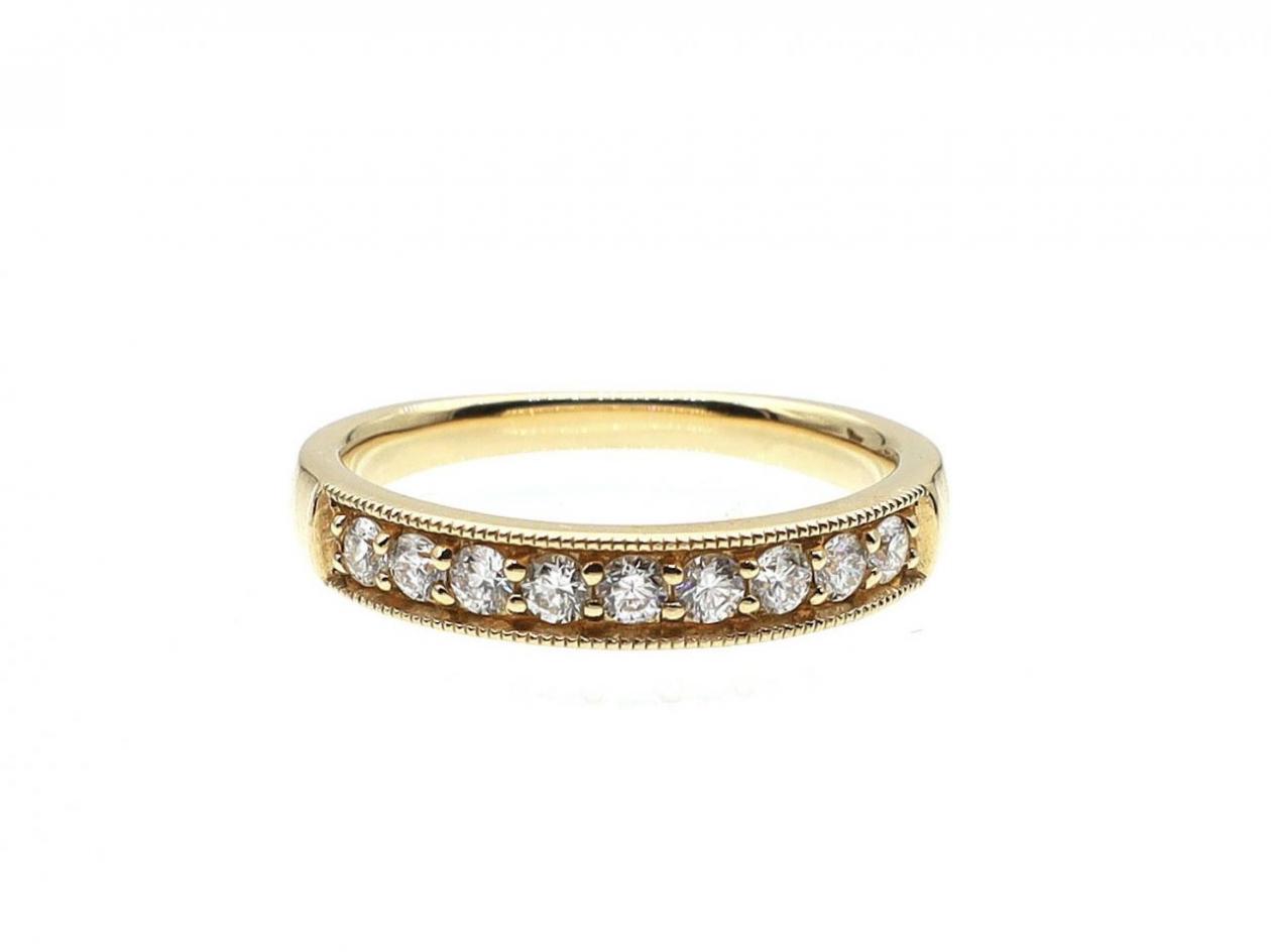 Diamond grain set half eternity ring in 18kt yellow gold