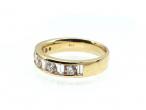 Half eternity band set with round and baguette cut diamonds in gold