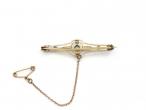 Antique peridot and seed pearl bar brooch in yellow gold