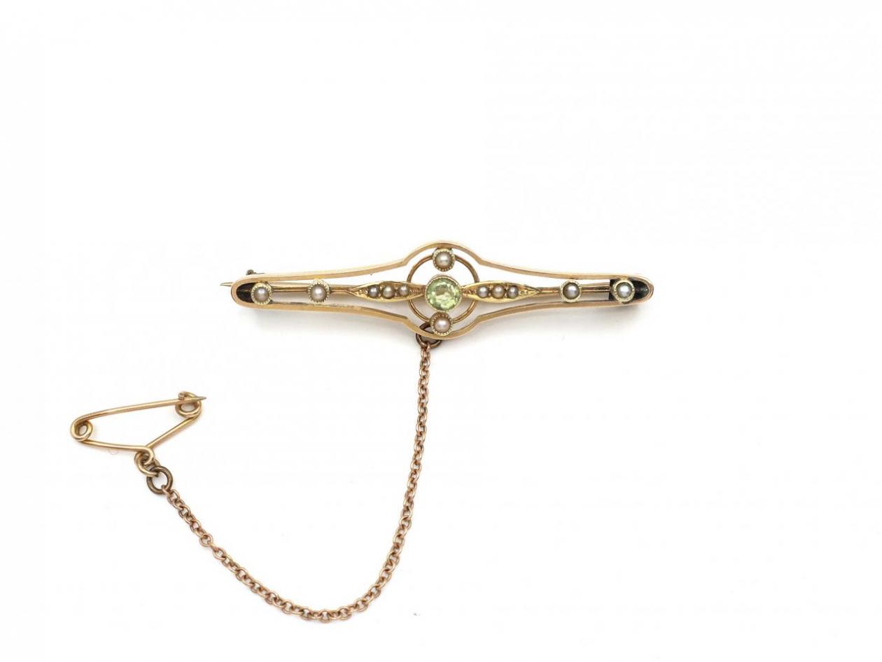 Antique peridot and seed pearl bar brooch in yellow gold