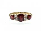 Victorian ruby and diamond three stone carved ring in gold