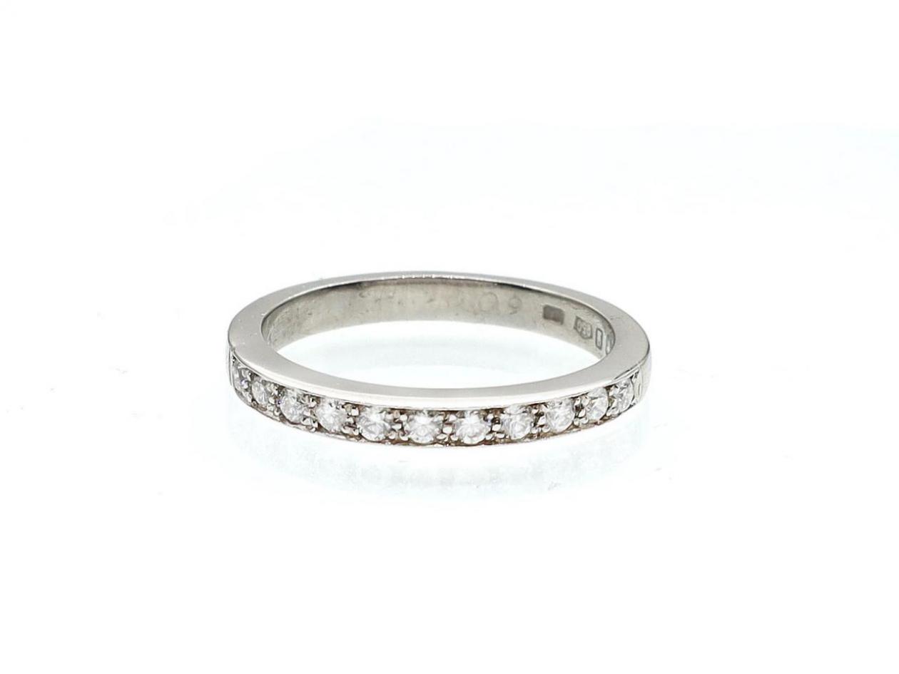Platinum grain set diamond half eternity ring