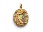 Antique Irish harp locket set with emeralds in yellow and green gold