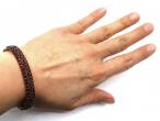 1880s tomback and garnet hinged bangle with safety chain
