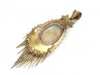 Antique emerald and seed pearl oval tassel locket in gold