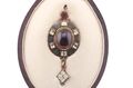 RENAISSANCE REVIVAL GARNET, CHRYSOBERYL AND ENAMEL HOLBEINESQUE PENDANT, CIRCA 1870.