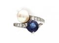 Cultured pearl and sapphire crossover ring in 18kt white gold