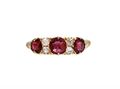 1889 ruby and diamond three stone carved ring in 18kt yellow gold