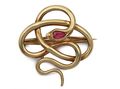 Vintage serpent brooch set with a synthetic ruby in 14kt gold