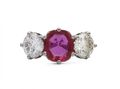 Vintage fancy pink sapphire and diamond three stone engagement ring