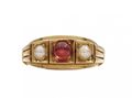 Antique ruby cabochon and pearl three stone ring in gold