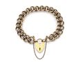 1987 solid yellow gold curb bracelet with heart lock