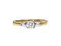 Flanked diamond solitaire engagement ring in 18kt yellow gold
