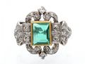 Art Deco emerald and diamond cluster ring in gold and platinum