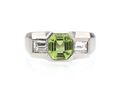 Art Deco peridot and diamond three stone ring in platinum